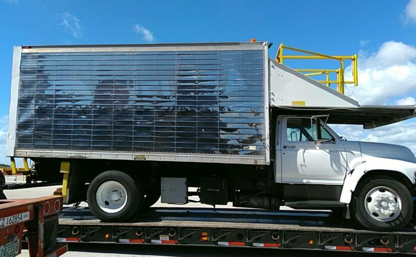Towing a 1998 Kidron Box Truck with Heavy Equipment Transport