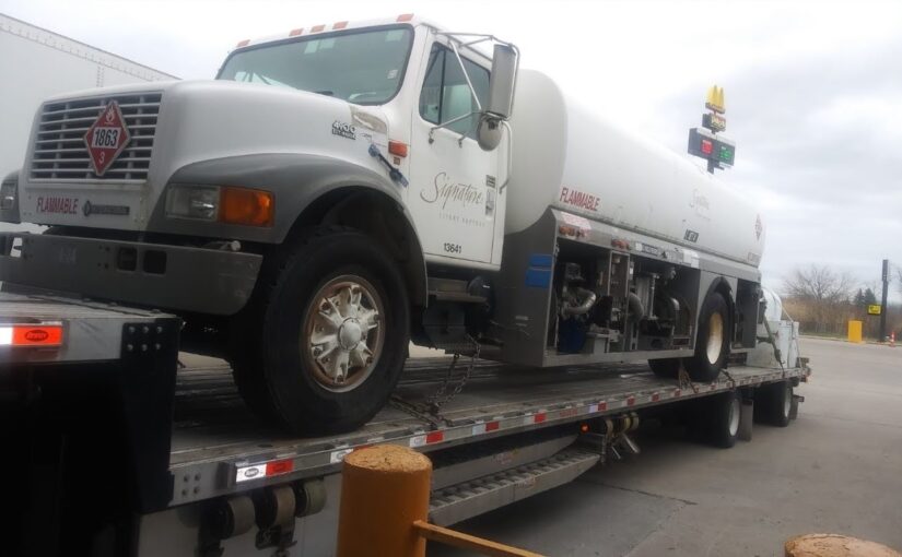 Towing a 1998 International Aircraft Fuel Truck and a 750 Gallon Tank