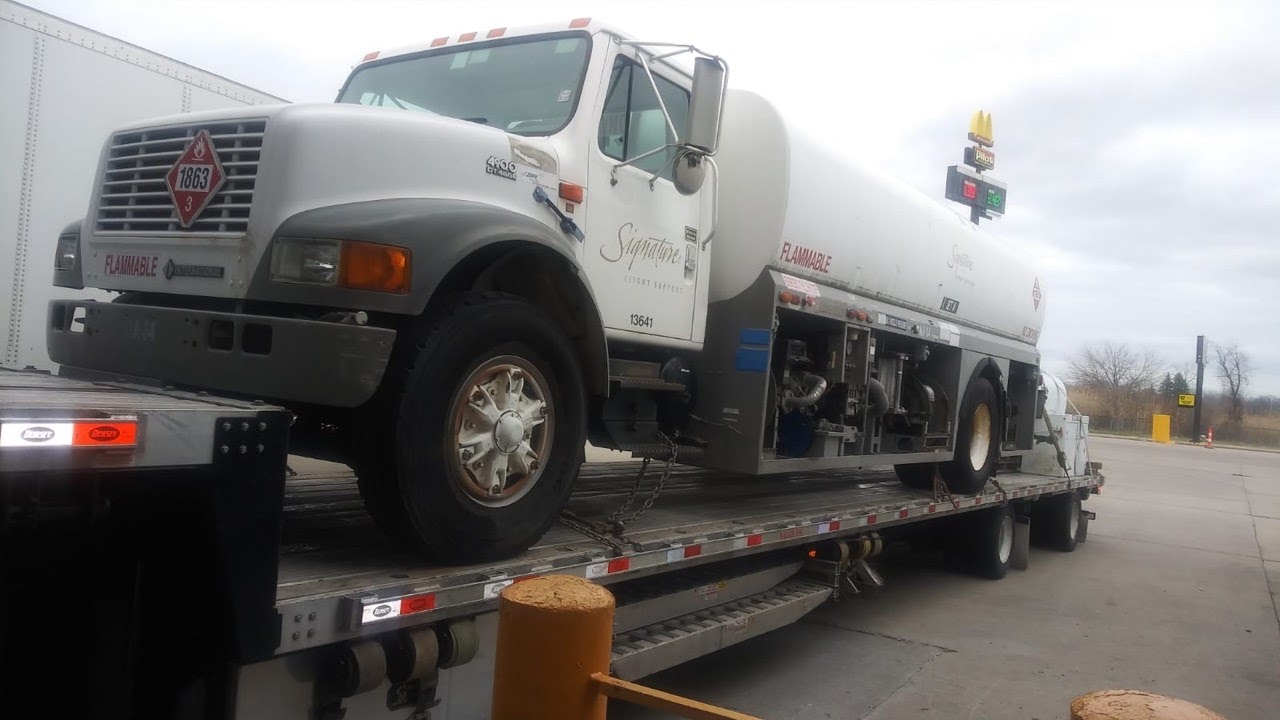 Towing a 1998 International Aircraft Fuel Truck and a 750 Gallon Tank