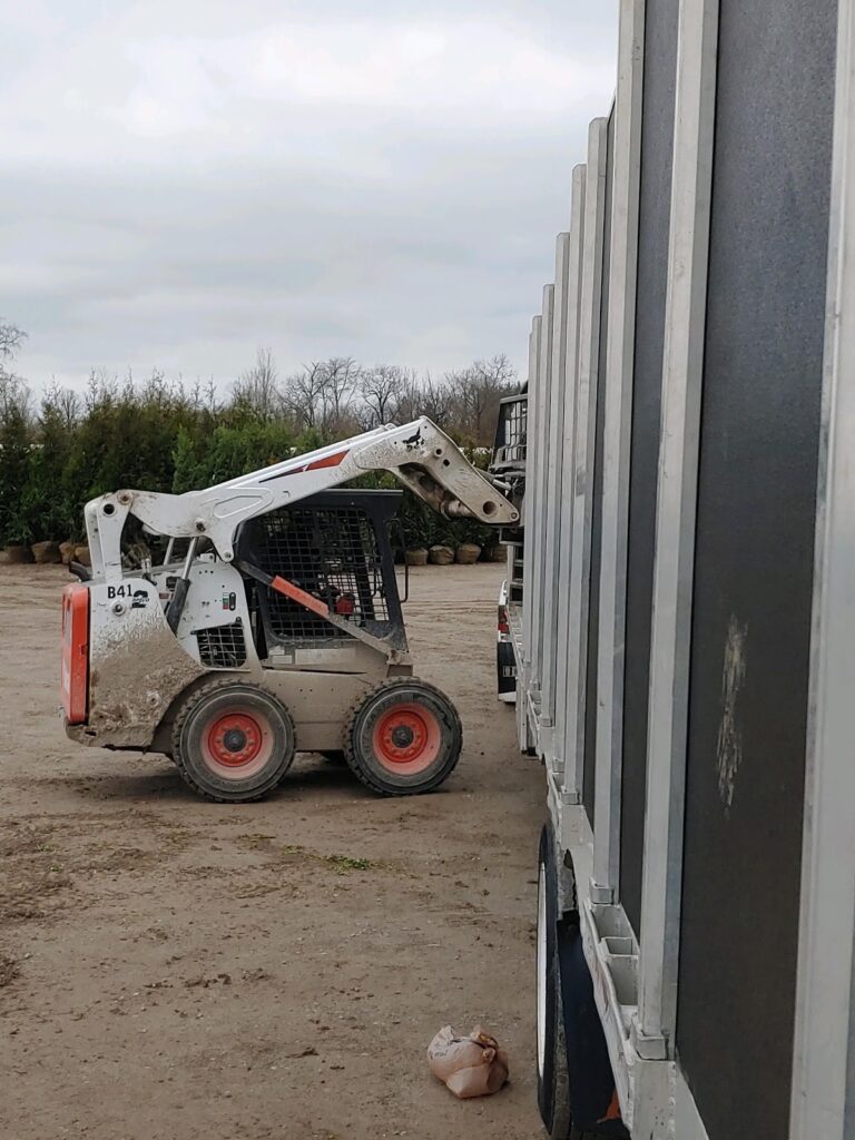 Skid steer loading trees for transport