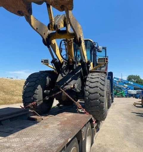 Transporting a CMI RS500B Tractor and a Komatsu WA480 Wheel Loader