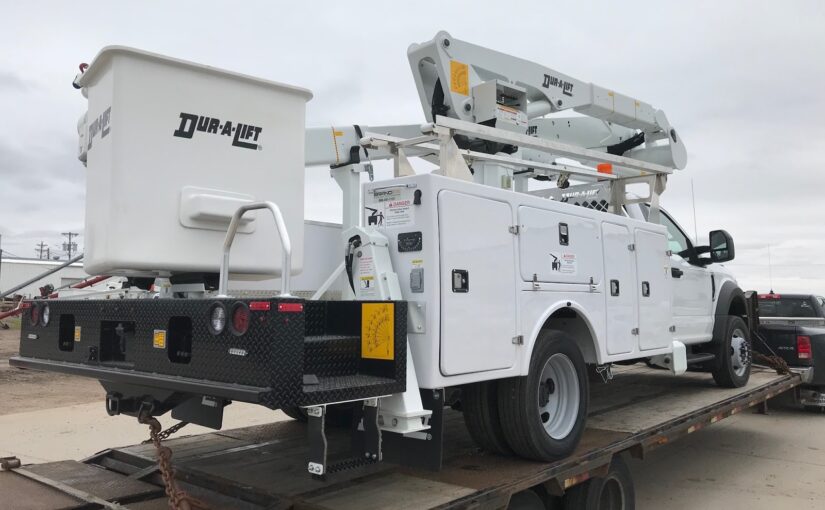 Transporting a Ford Crane Truck with the Pros