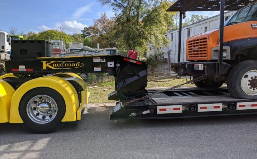 Shipping a GMC C7500 Bucket Truck with Heavy Equipment Transport
