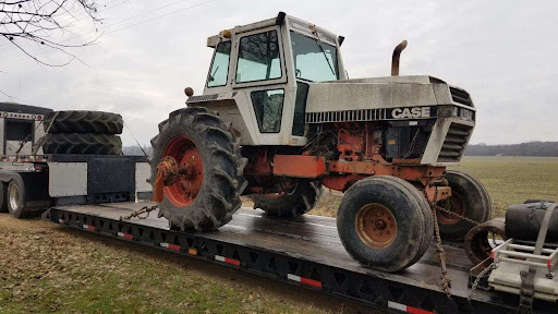 Case tractor for transport on RGN trailer