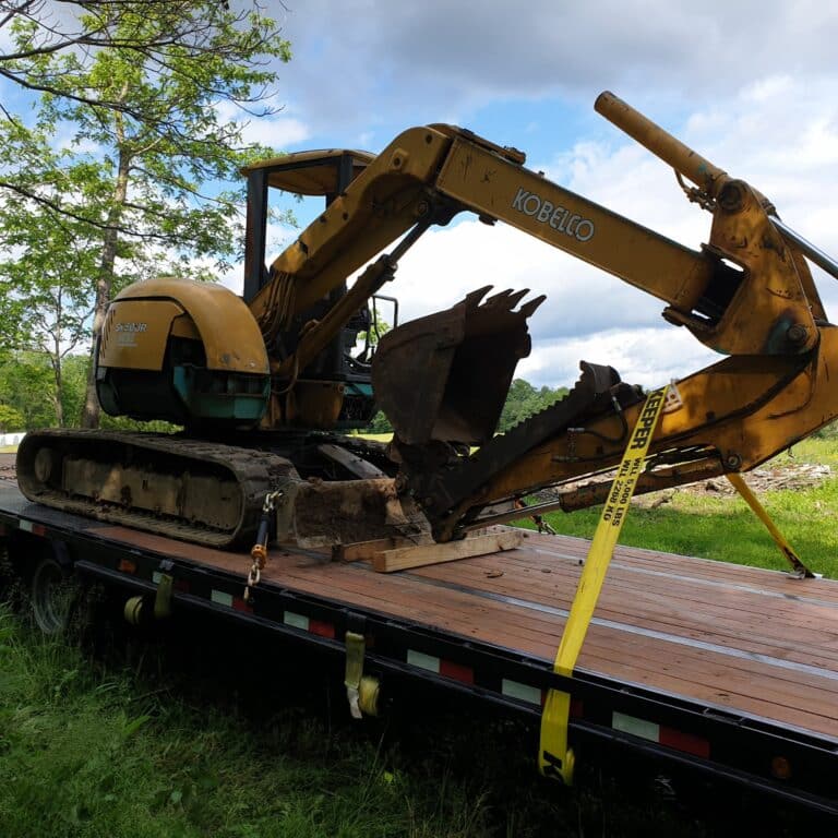kobelco excavator on trailer