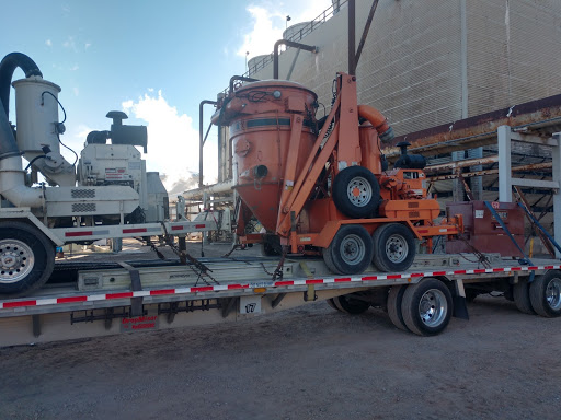 Assorted construction equipment on a trailer