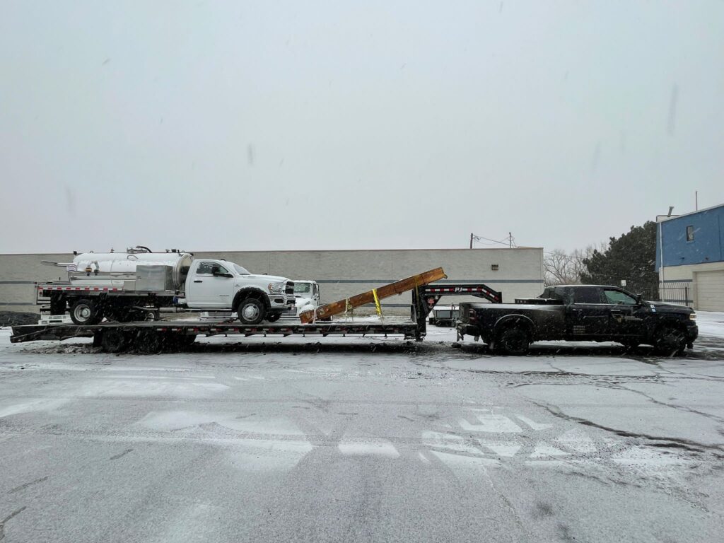work truck on hot shot trailer