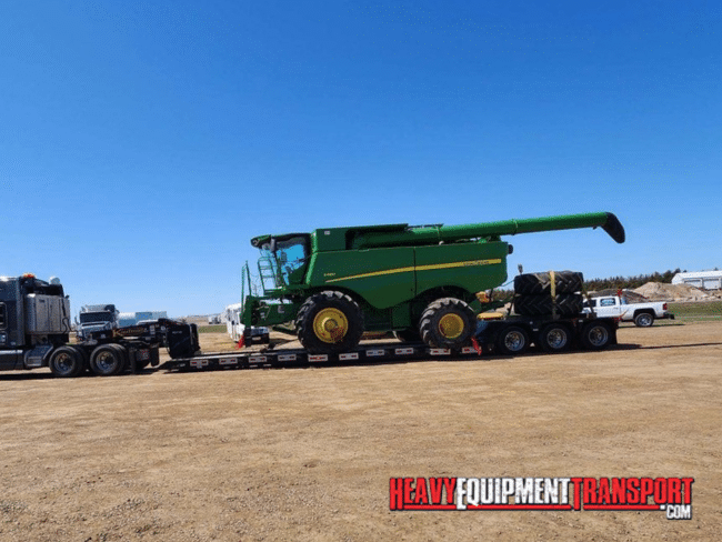 combine on RGN trailer