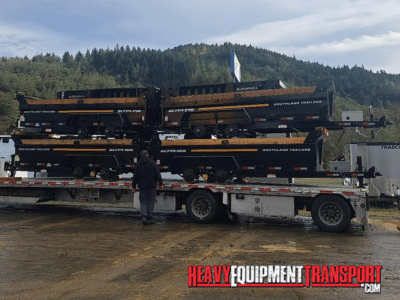 Southland trailers loaded for transport on a step deck trailer