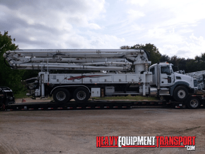 Transporting a 2017 Mack Schwing GU 813 Concrete Boom Truck on a lowboy trailer
