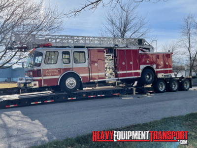 1992 E-ONE HURRICANE LADDER TRUCK shipping on a RGN trailer