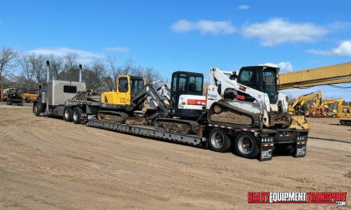 Shipping an excavator and skid steer on a lowboy trailer.