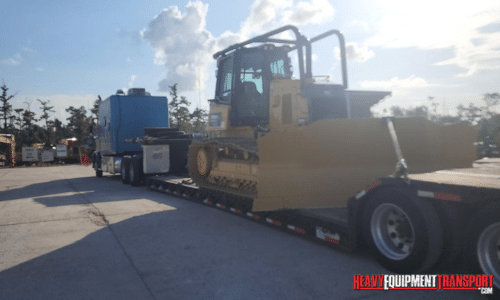 Shipping a bulldozer on a lowboy trailer.