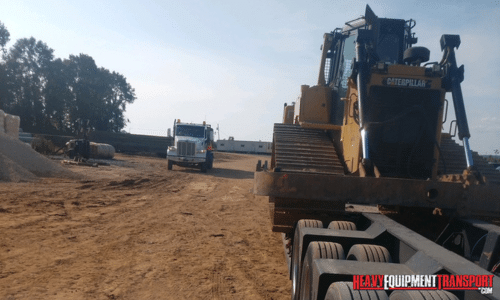 Shipping a bulldozer on a construction site.