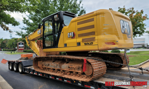 Transporting an excavator on a lowboy trailer.
