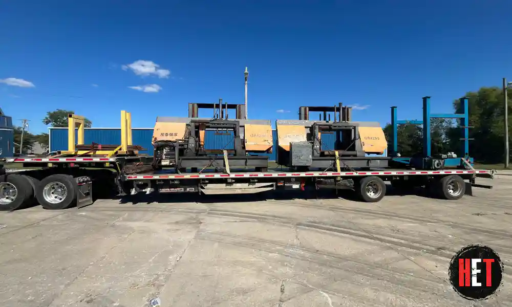 Manufacturing equipment being transported on a flatbed truck