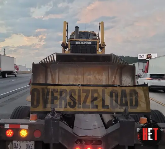 2010 Komatsu D155ax 6 transported by a semi truck.