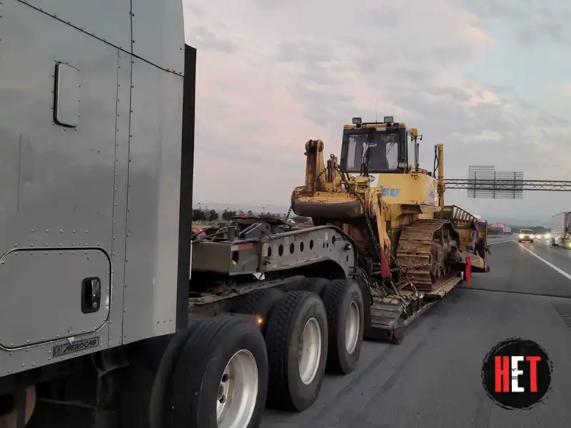 2010 Komatsu D155ax 6 transported by a semi truck.