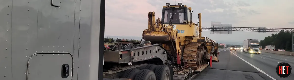 2010 Komatsu D155ax 6 transported by a semi truck.