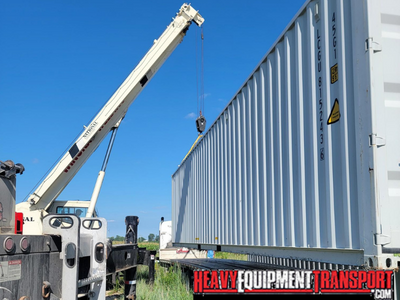 Transporting a 40ft loaded shipping container.