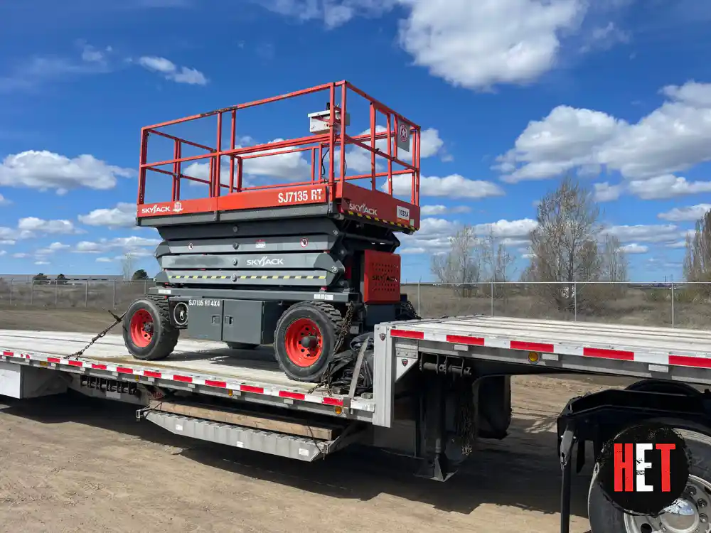 Hauling a 2015 Skyjack SJ7135 RT 4x4 scissor lift