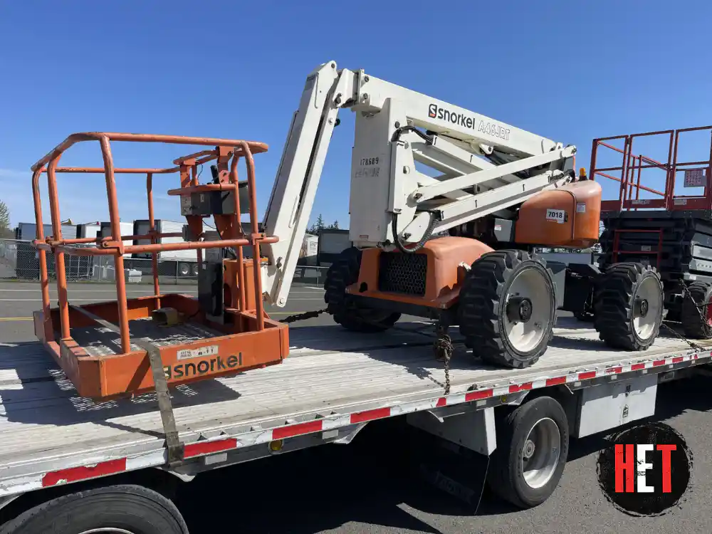 Hauling a Snorkel A46JRT articulating boom lift