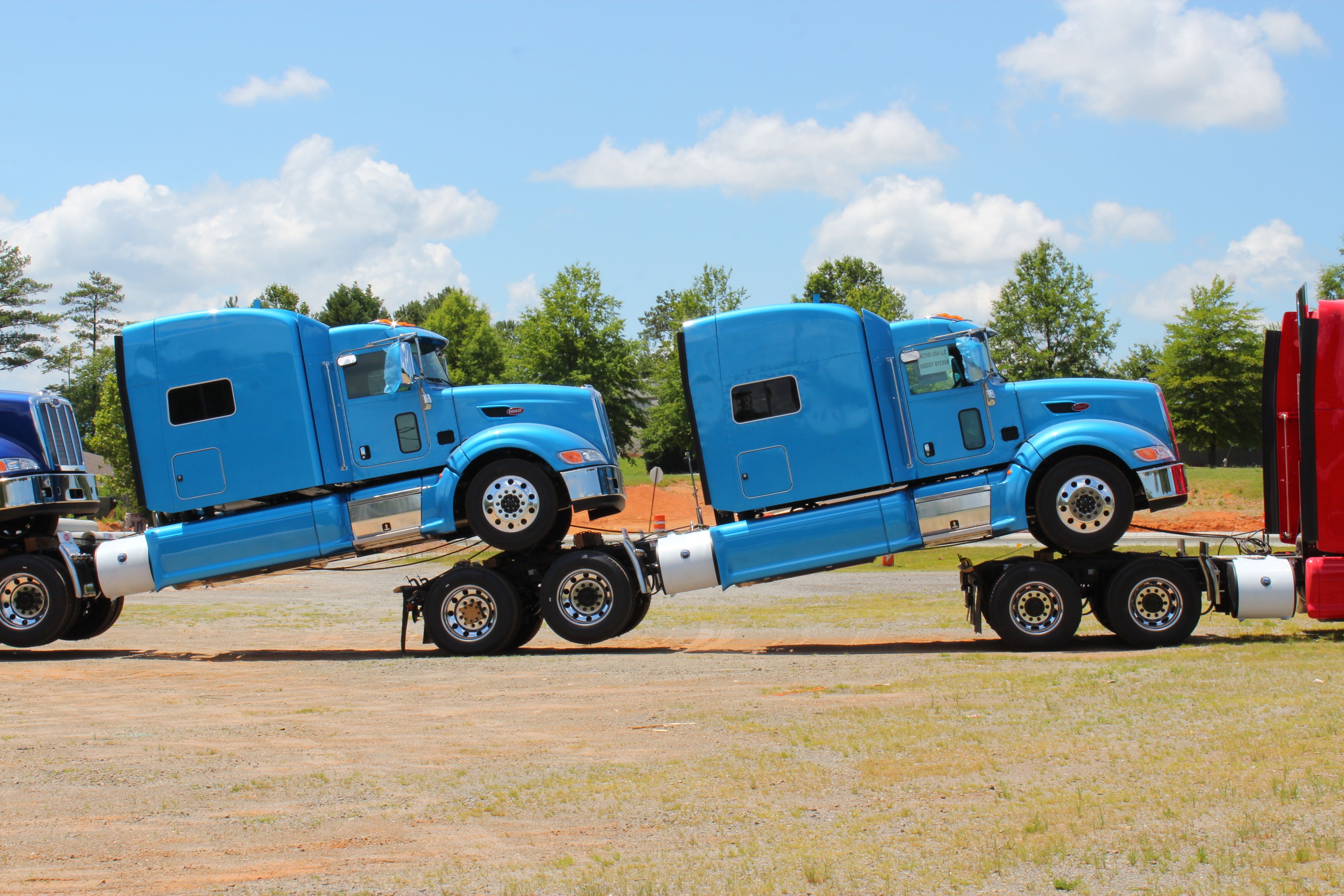 Transporting two semi trucks.