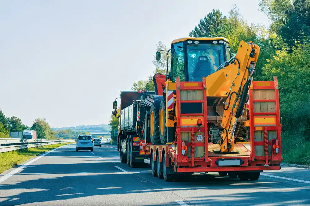 Transporting an excavator via a semitruck.