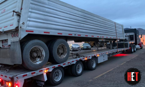 End dump trailer hauled on another trailer