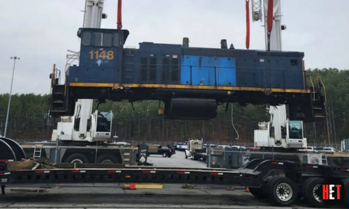 Hauling a train engine.