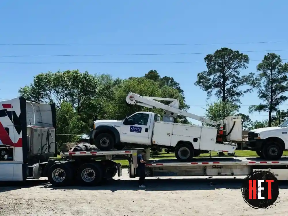 Hauling 2 ford f-450 bucket trucks