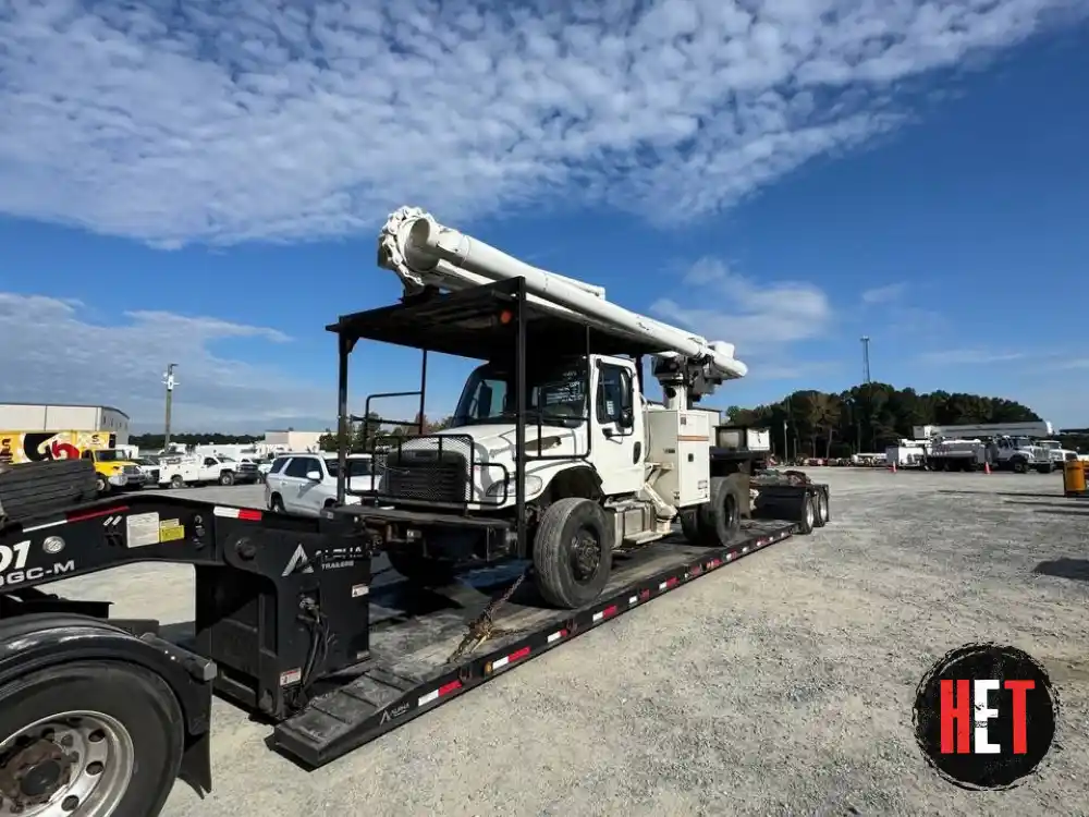 transporting a 2016 Freightliner M2 106 bucket boom truck.