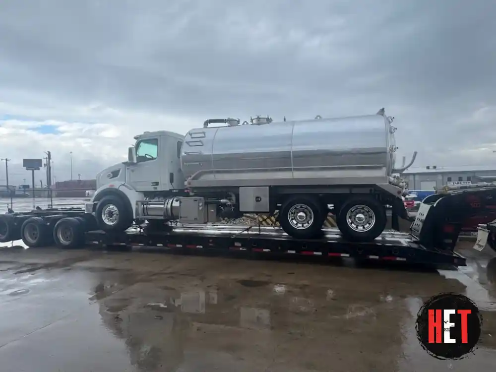 Transporting a Peterbilt 567 septic tank truck