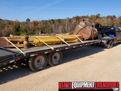 Transporting a CAT 330 excavator stick and bucket.